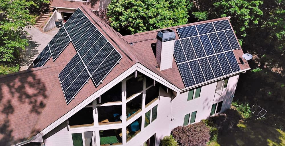 Aerial view of a home with rooftop solar