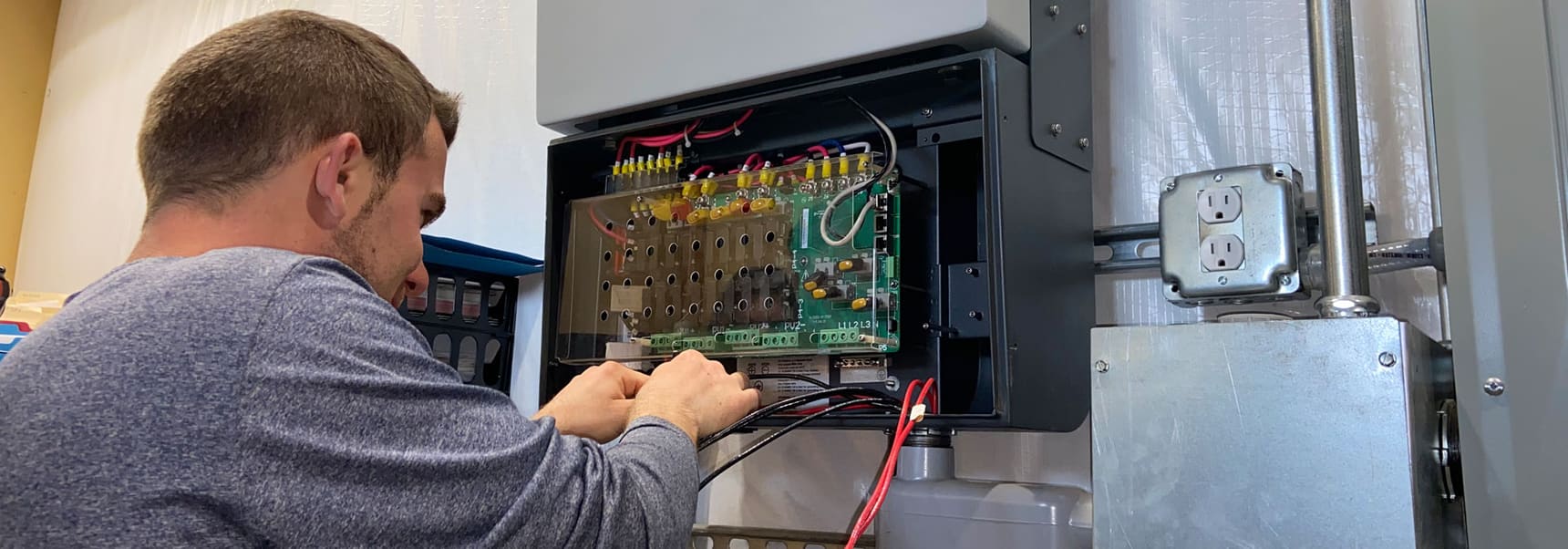 Example: Technician working on solar electrical equipment