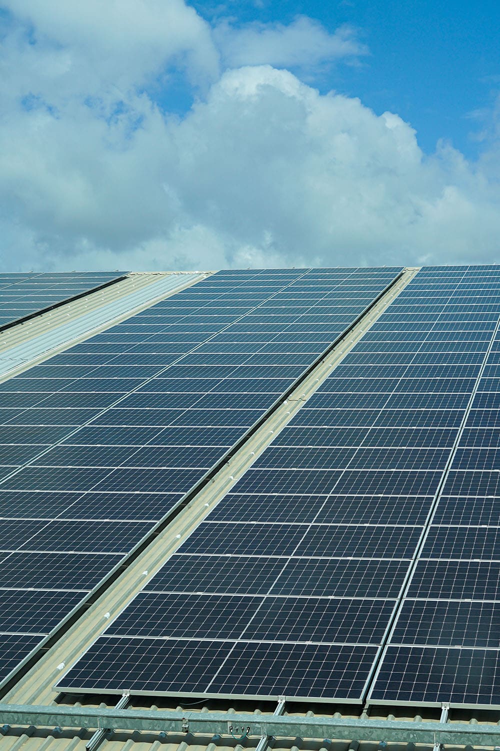 Solar panels on a roof under a blue sky