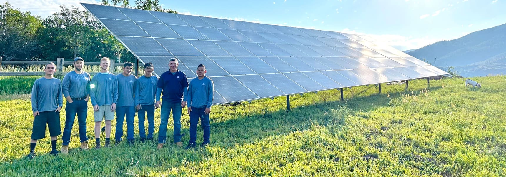 The Detail Solar crew standing in front of a ground mount solar array